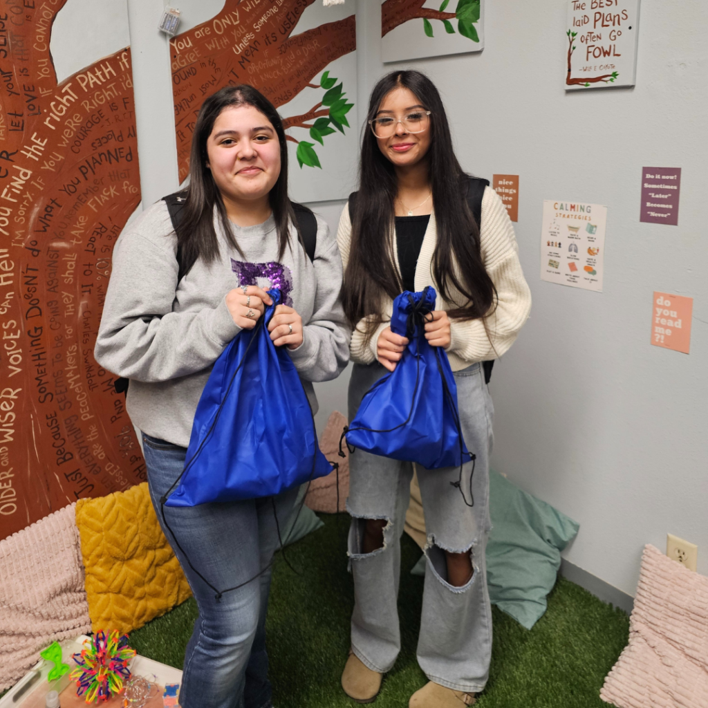 Communities In Schools student support and resources, Dallas region, students with drawstring bags.